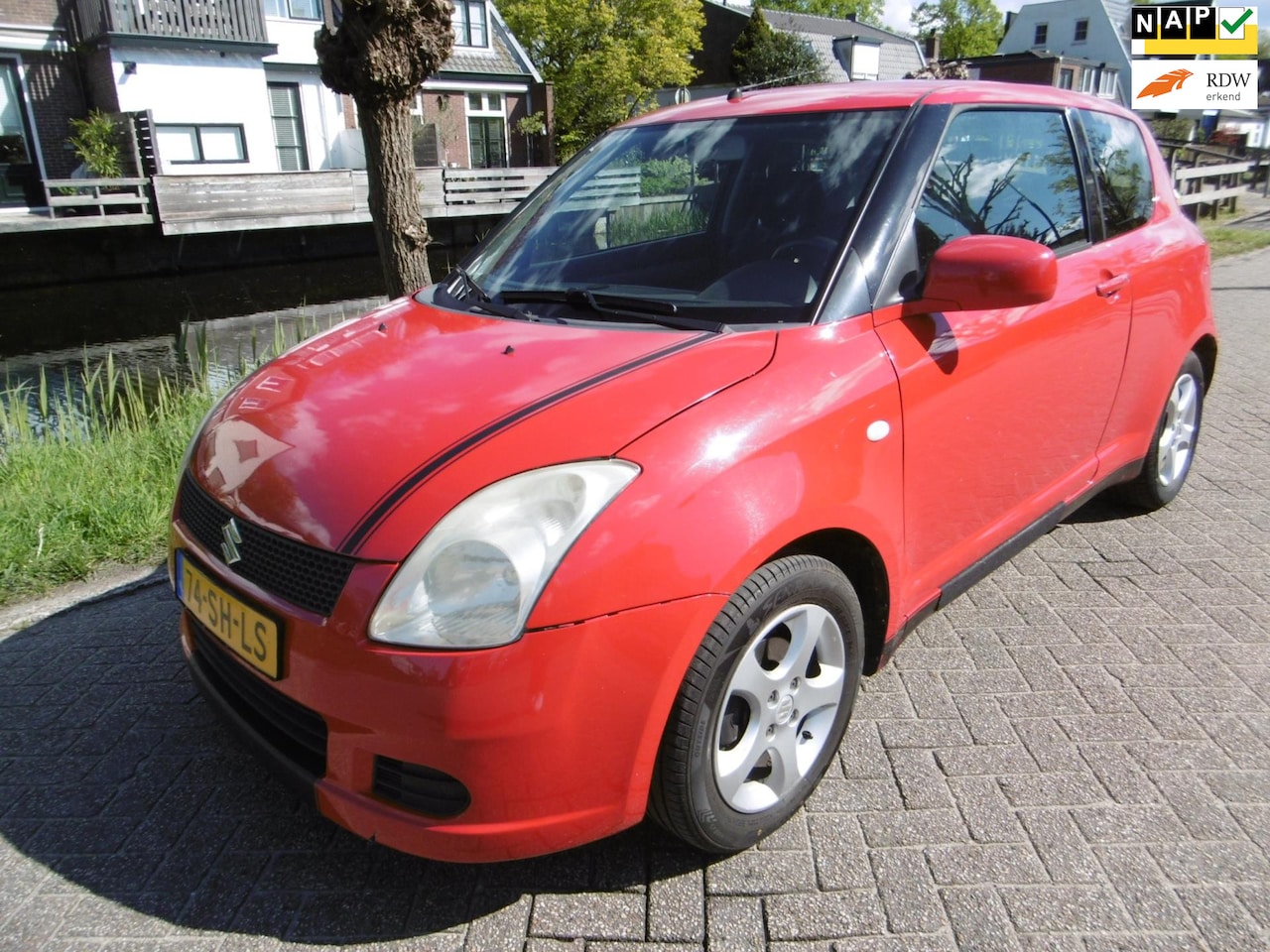 Suzuki Swift - 1.3i Automaat Airco Aangepaste (invalide-)auto Handrem + Handgas - AutoWereld.nl