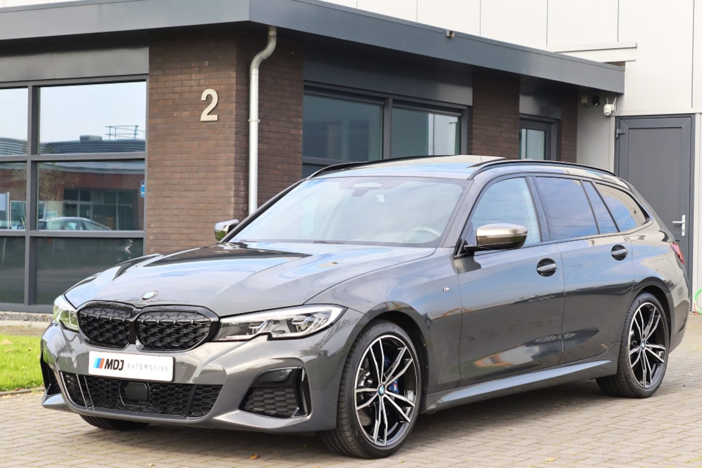 BMW 3-serie Touring - M340i xDrive Dravitgrau Pano Laser Head Up BTW auto - AutoWereld.nl