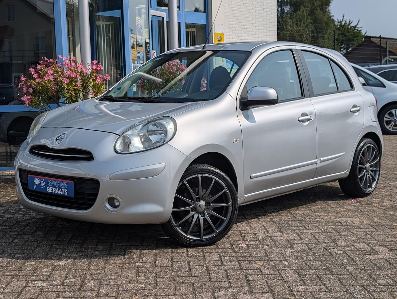 Nissan Micra - 1.2 Tekna | Navigatie, Climate Control, Cruise Control, Bluetooth, Elektr. ramen, 17 inch - AutoWereld.nl