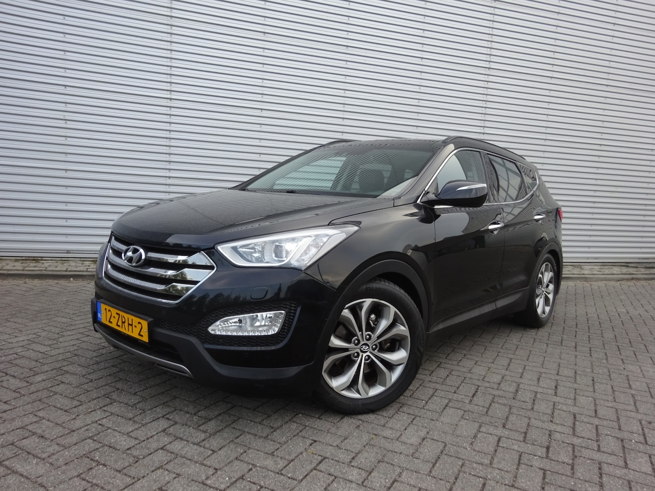 Hyundai Santa Fe - 2.2 CRDi 4WD i-Catcher Automaat 7-Persoons / Leder / Trekhaak / Xenon / Cruise control - AutoWereld.nl