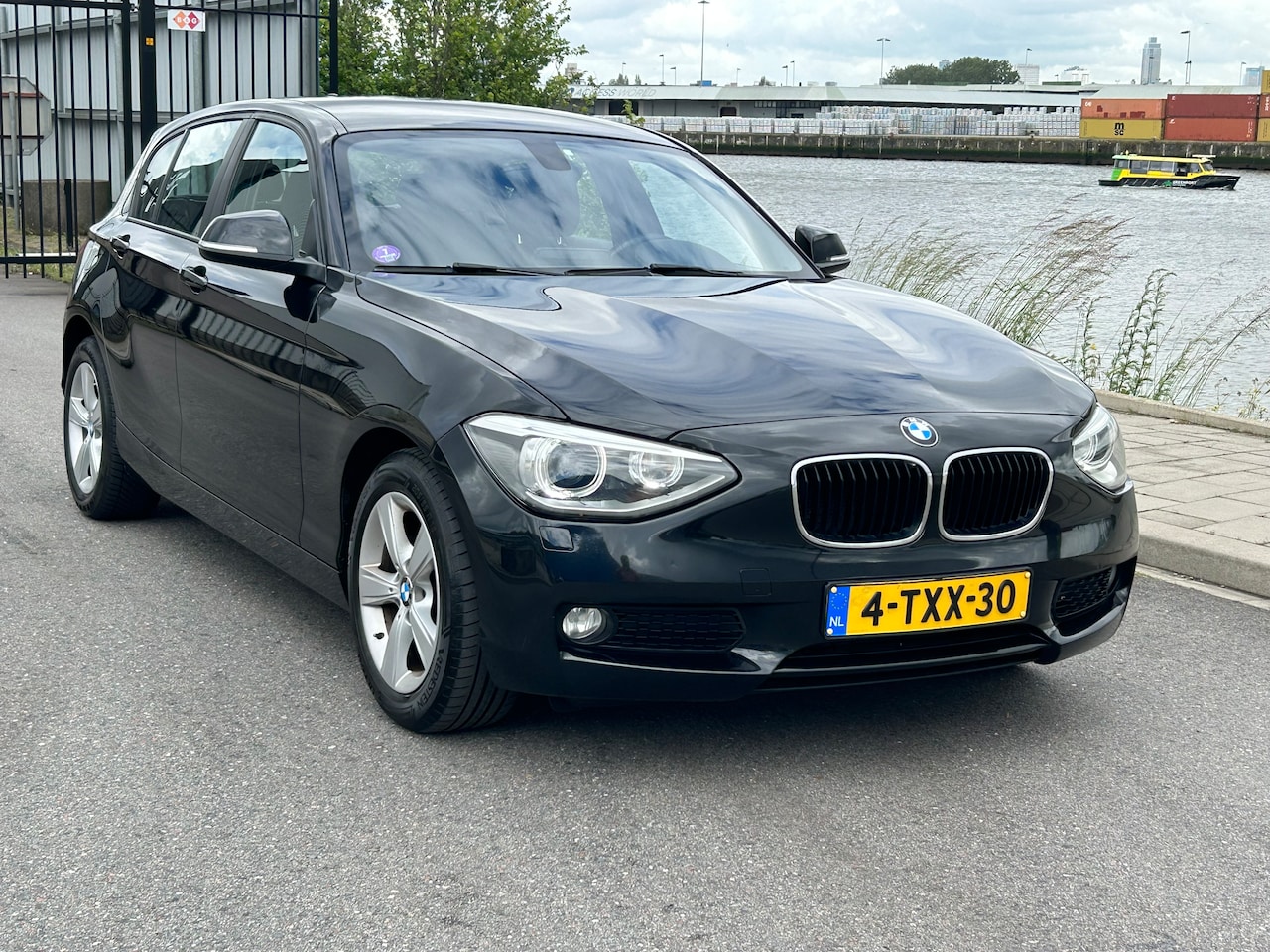 BMW 1-serie - 116i High Executive 136 PK AUT NAVI PDC ECC LED - AutoWereld.nl