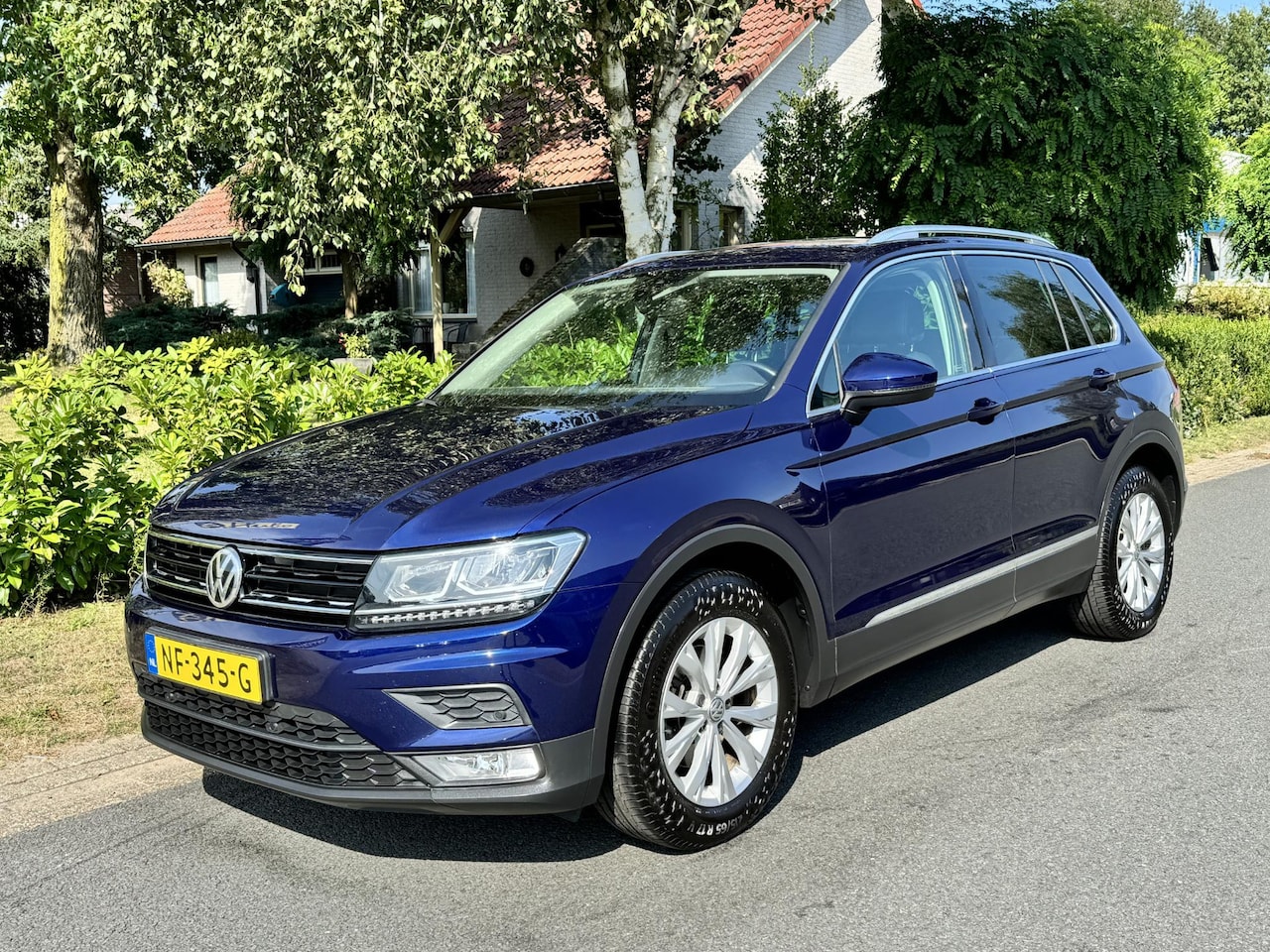 Volkswagen Tiguan - 1.4 TSI Highline 125PK NL-Auto•Leder•Navigatie - AutoWereld.nl