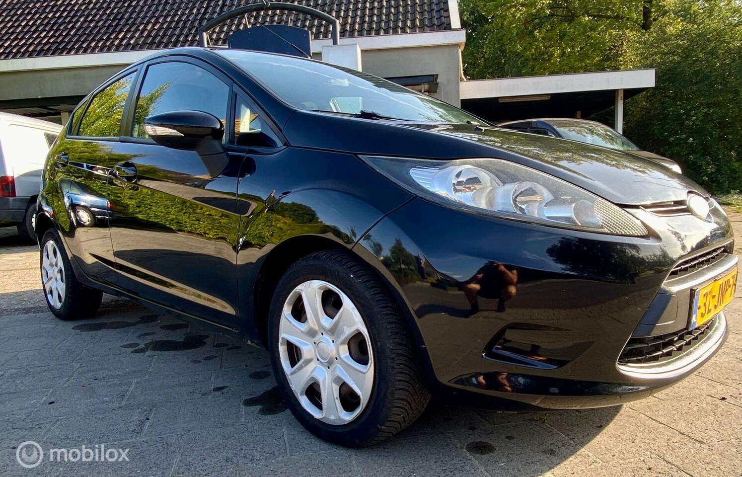 Ford Fiesta - 1.25 Ghia 1.25 Ghia - AutoWereld.nl