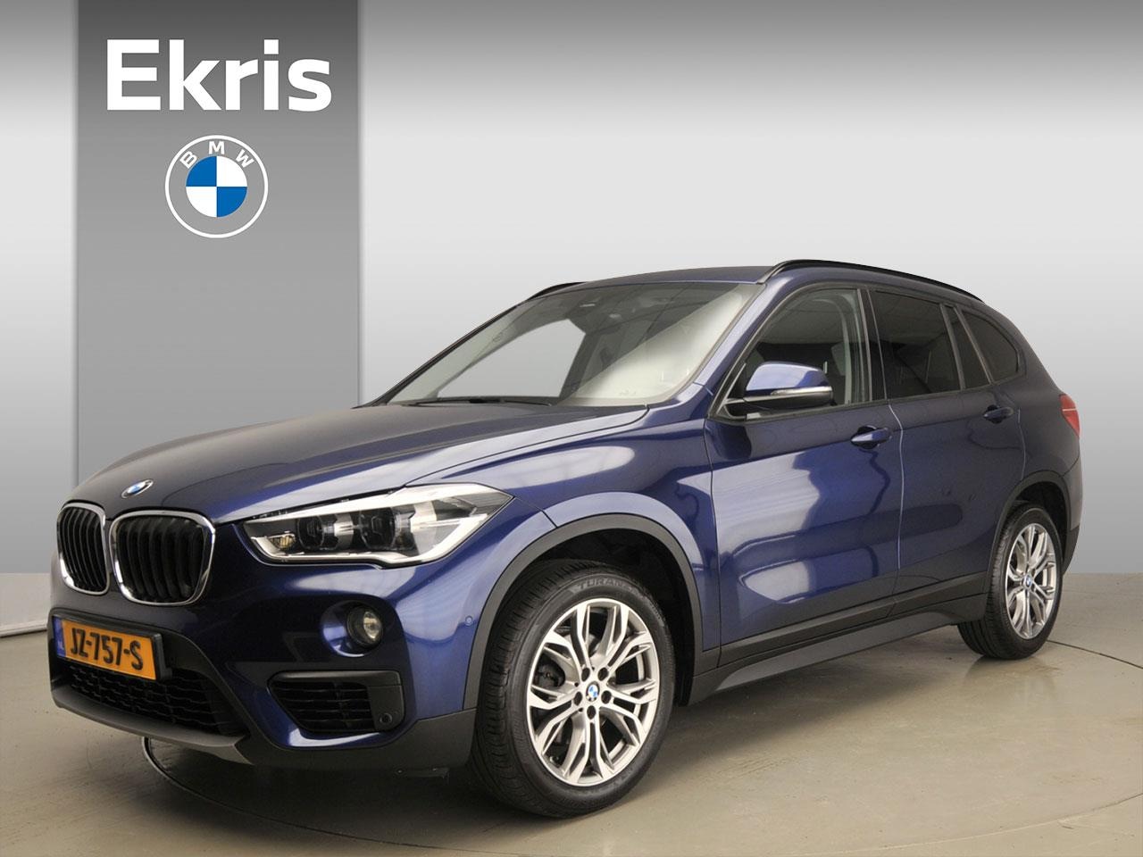 BMW X1 - sDrive18i Executive LED / Navigatie / Stoelverwarming / Clima / PDC / Lendesteunen / Alu 1 - AutoWereld.nl