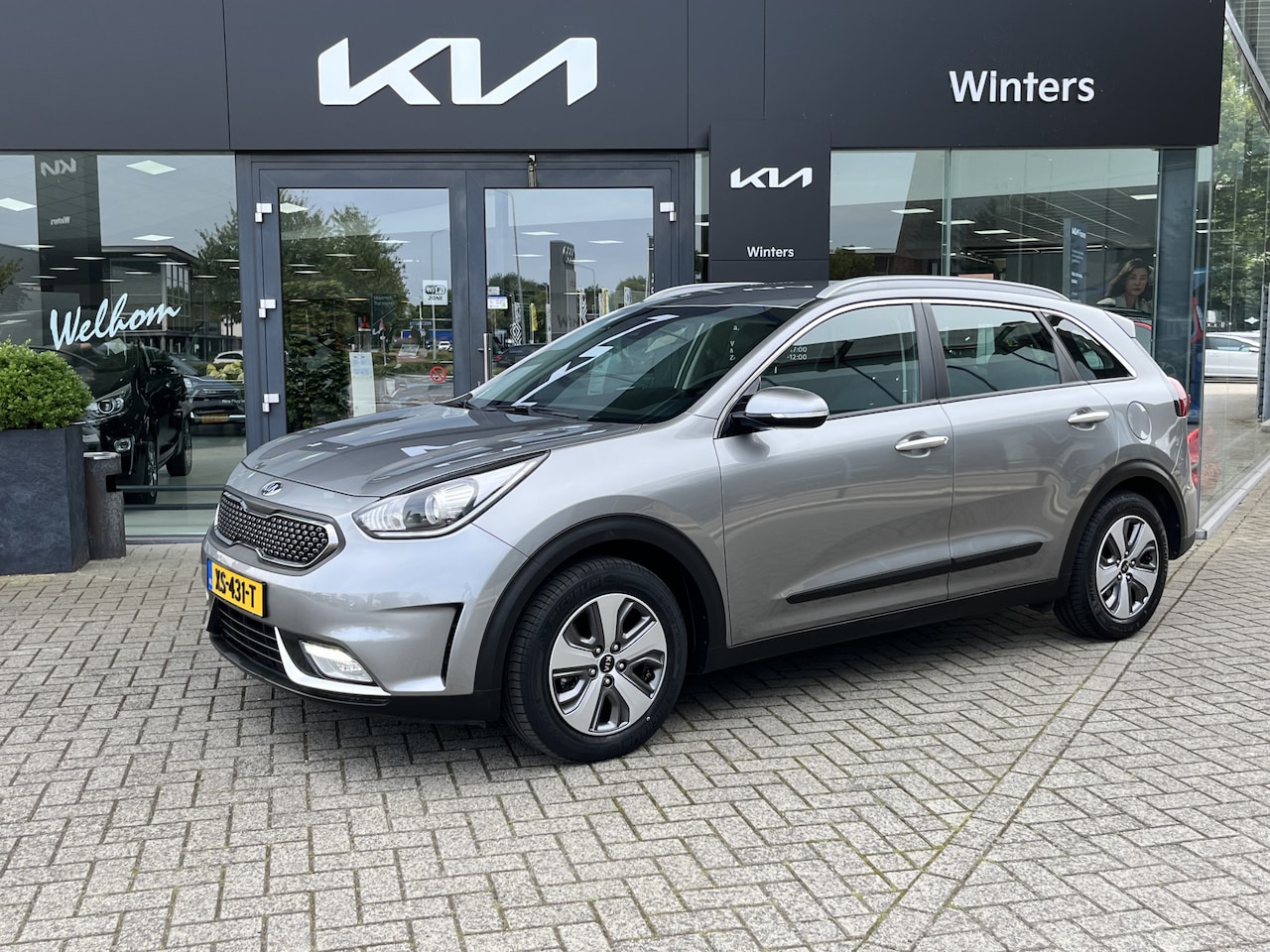 Kia Niro - 1.6i-16V Hybrid DynamicLine DCT6/Autom. ECC-Airco Cr.Control Navi+Camera+BT+USB 16"LMV Tre - AutoWereld.nl