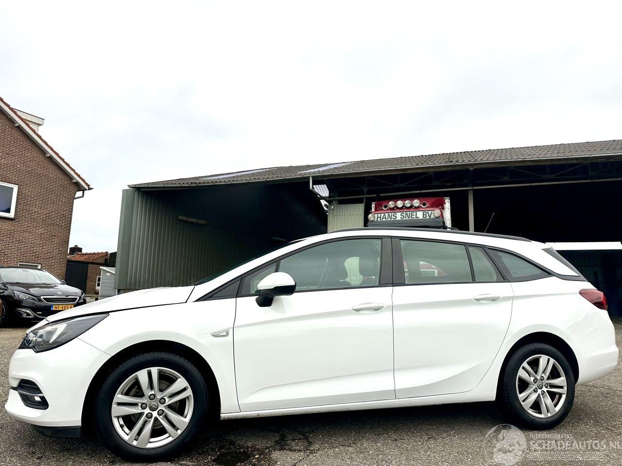 Opel Astra Sports Tourer - 1.4 Turbo 145pk automaat - navi - nap - org NL - airco - cruise - pdc - licht + regensenso - AutoWereld.nl