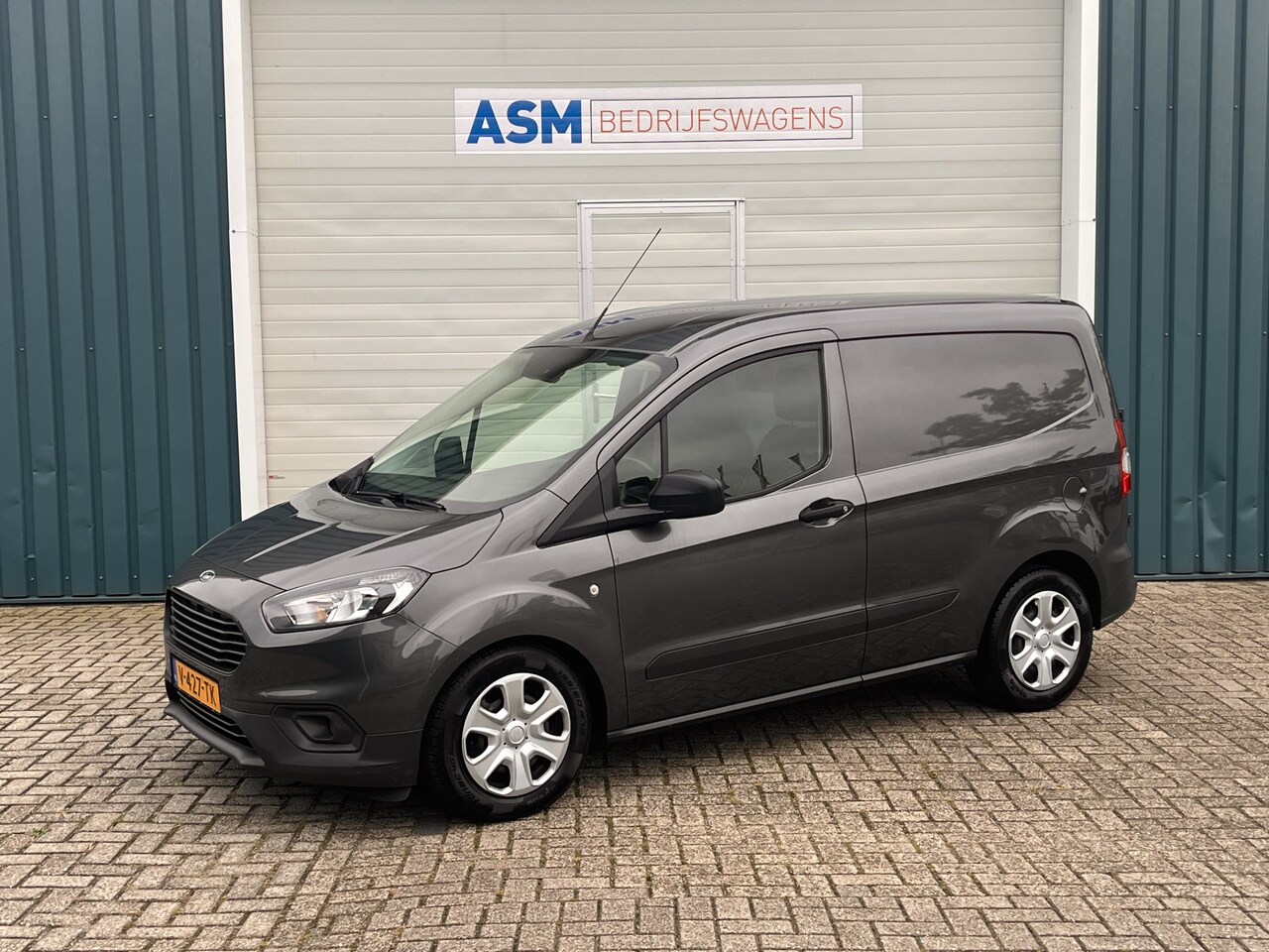 Ford Transit Courier - 1.5 75Pk TDCI Trend / Cruise / Airco / Navi / SCHUIFDEUR / Lease €166,- pm / Trekhaak / Ap - AutoWereld.nl