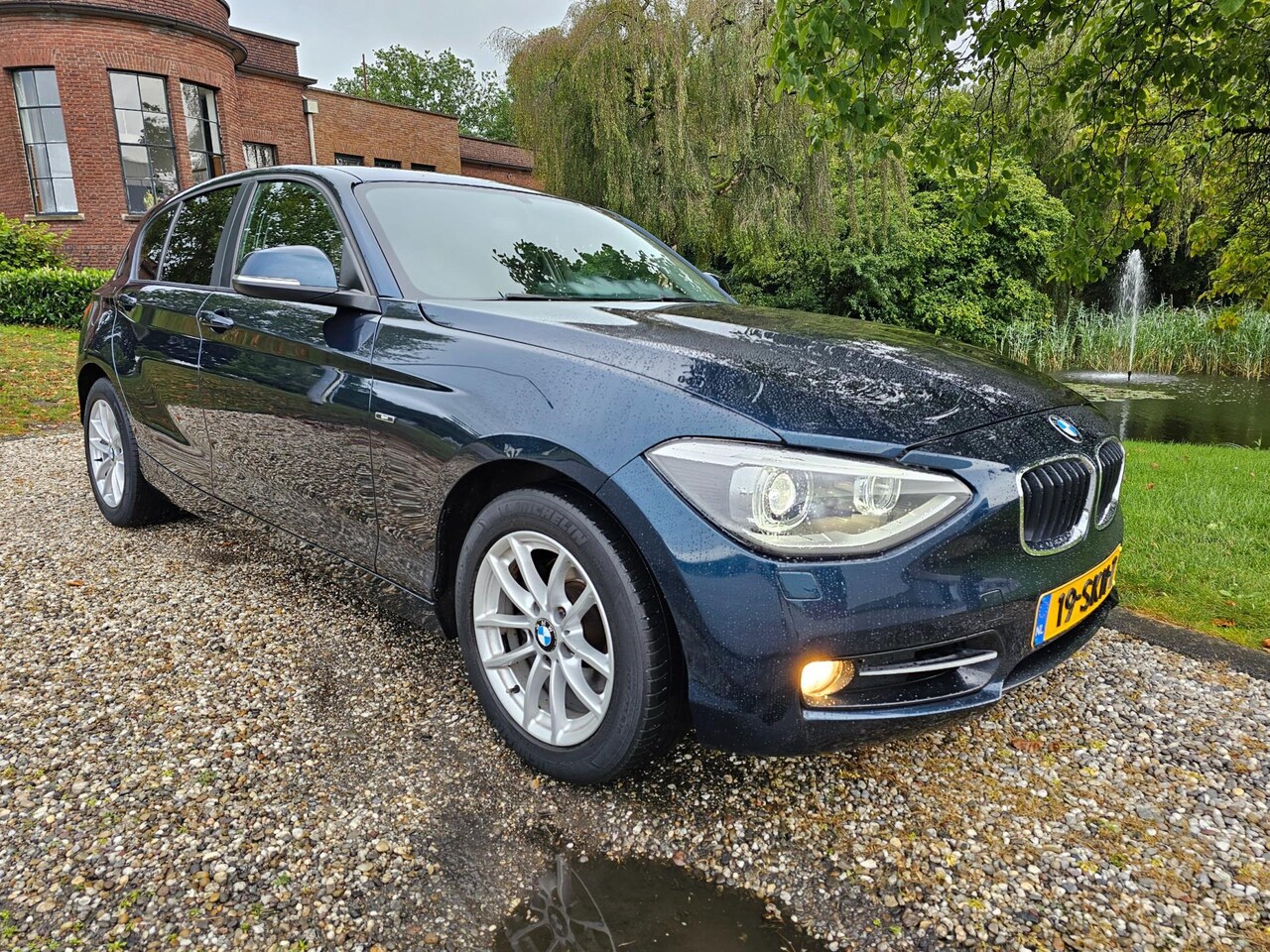 BMW 1-serie - 118i Business 5-deurs AUTOMAAT/xenon/NAVI - AutoWereld.nl