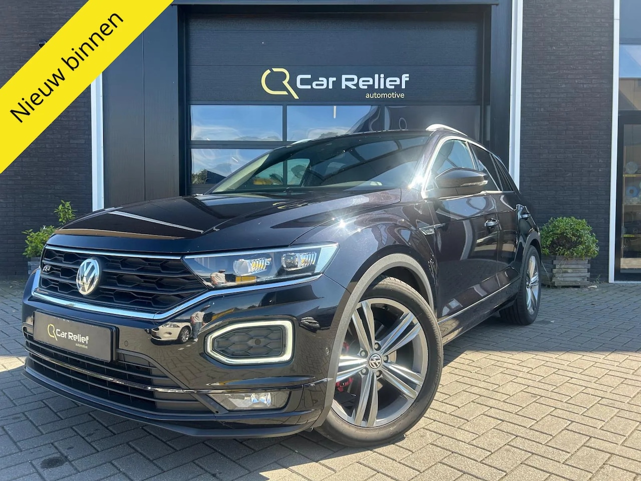 Volkswagen T-Roc - 1.5 TSI Sport 1.5 TSI Sport, R Line, Parkeercamera, Parkeersensoren v/a, ACC, Stoelverwarming, Apple Car - AutoWereld.nl