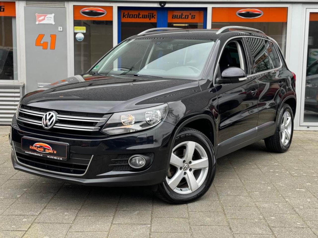 Volkswagen Tiguan - 1.4 TSI Sport&Style Navigatie Clima Cruise LM Dealer Onderhouden - AutoWereld.nl