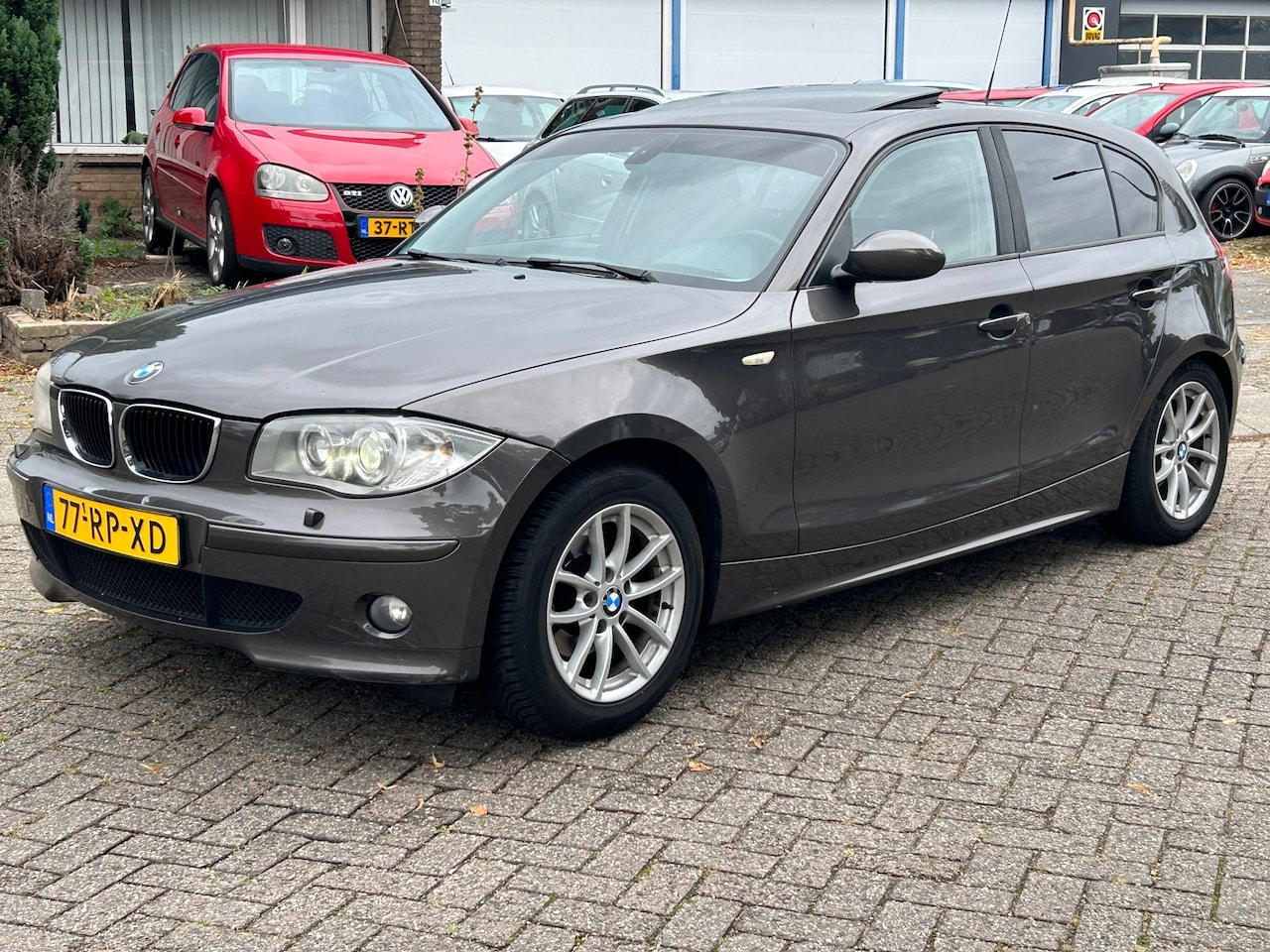 BMW 1-serie - 118i High Executive open dak! xenon! Idrive! clima! cruise control! - AutoWereld.nl