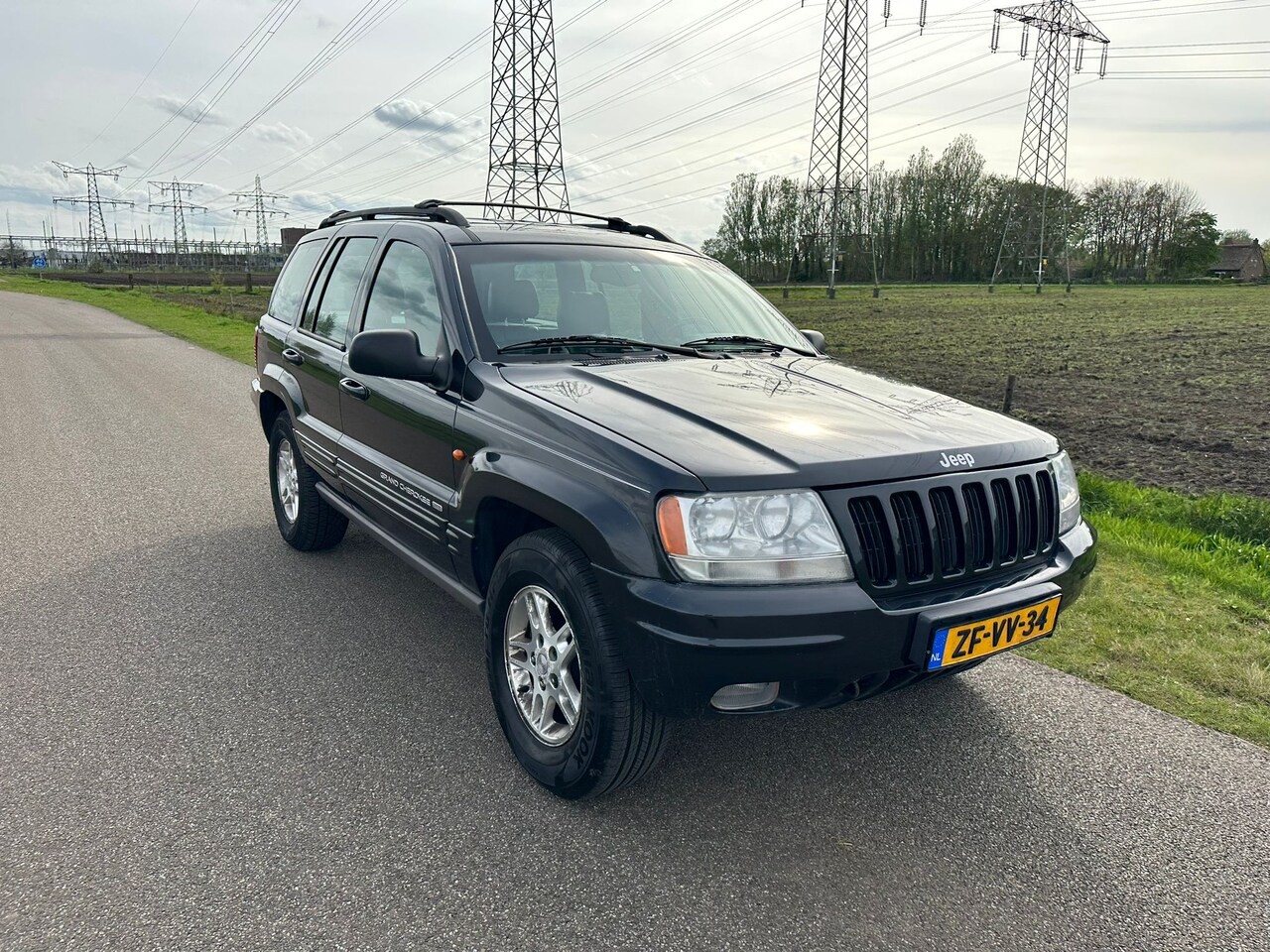 Jeep Grand Cherokee - 4.7i V8 Limited AIRCO ! - AutoWereld.nl