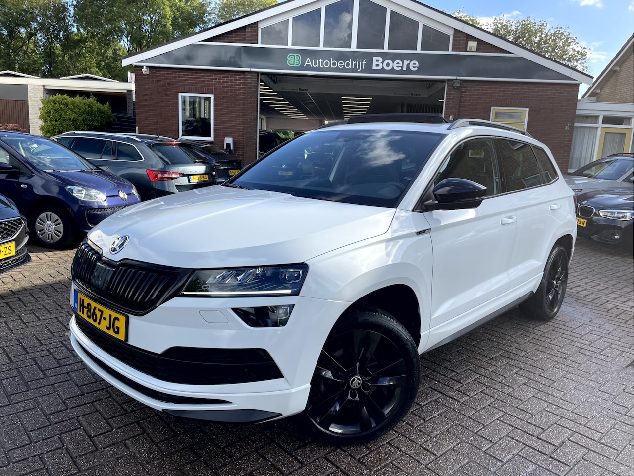 Skoda Karoq - 1.5 TSI ACT Sportline Business Camera, Pano-dak, Stoel/Stuur Verwarming - AutoWereld.nl