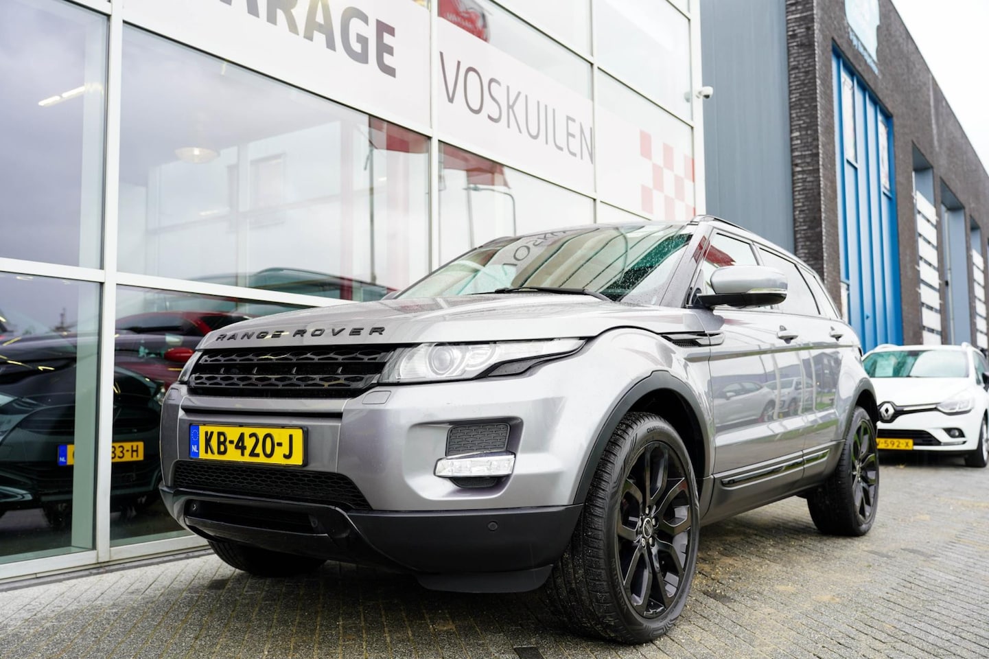 Land Rover Range Rover Evoque - 2.0 Si 4WD Prestige | Trekhaak | Panoramadak |Beige Leder - AutoWereld.nl