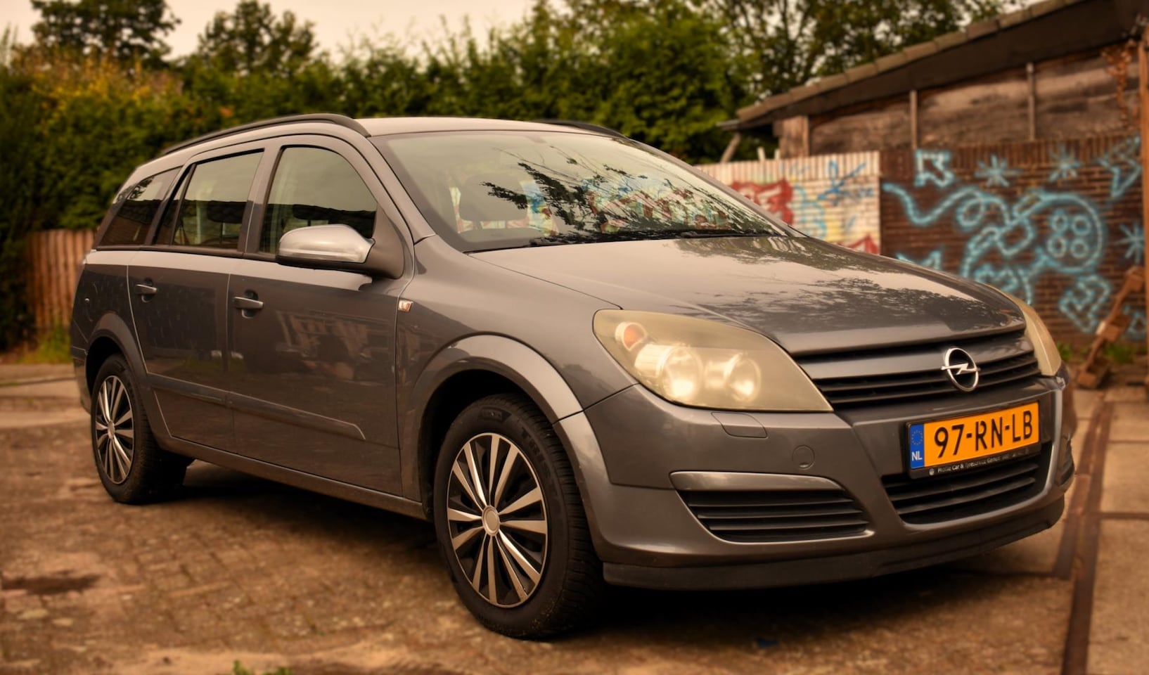 Opel Astra Wagon - 1.6 Enjoy MET CRUISE-CONTROL, AIRCO EN MEER! - AutoWereld.nl