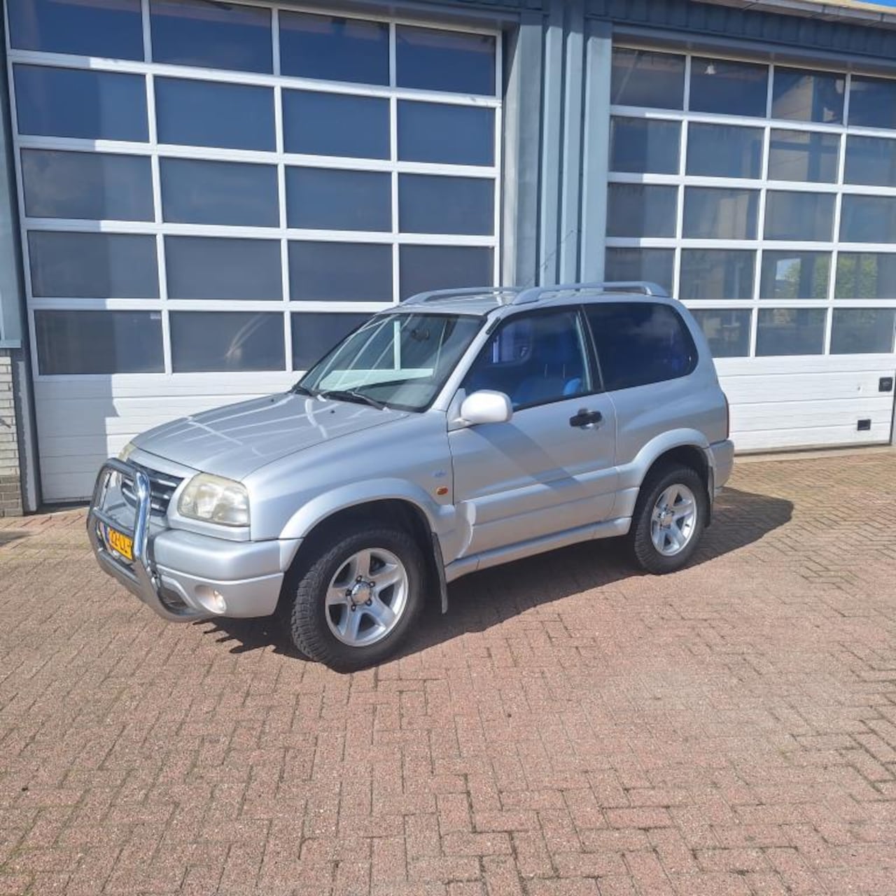 Suzuki Grand Vitara - 2.0 Metal Top Wide Body 2.0 Metal Top Wide Body - AutoWereld.nl