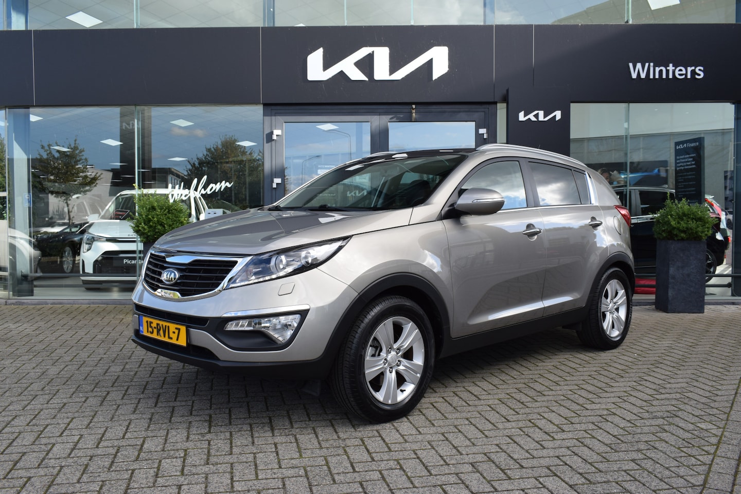 Kia Sportage - 1.6i-16V X-Clusive ECC Cr.Control Navi+Camera+BT Leder+Verw. Pano-dak Xenon Trekhaak 17"LM - AutoWereld.nl