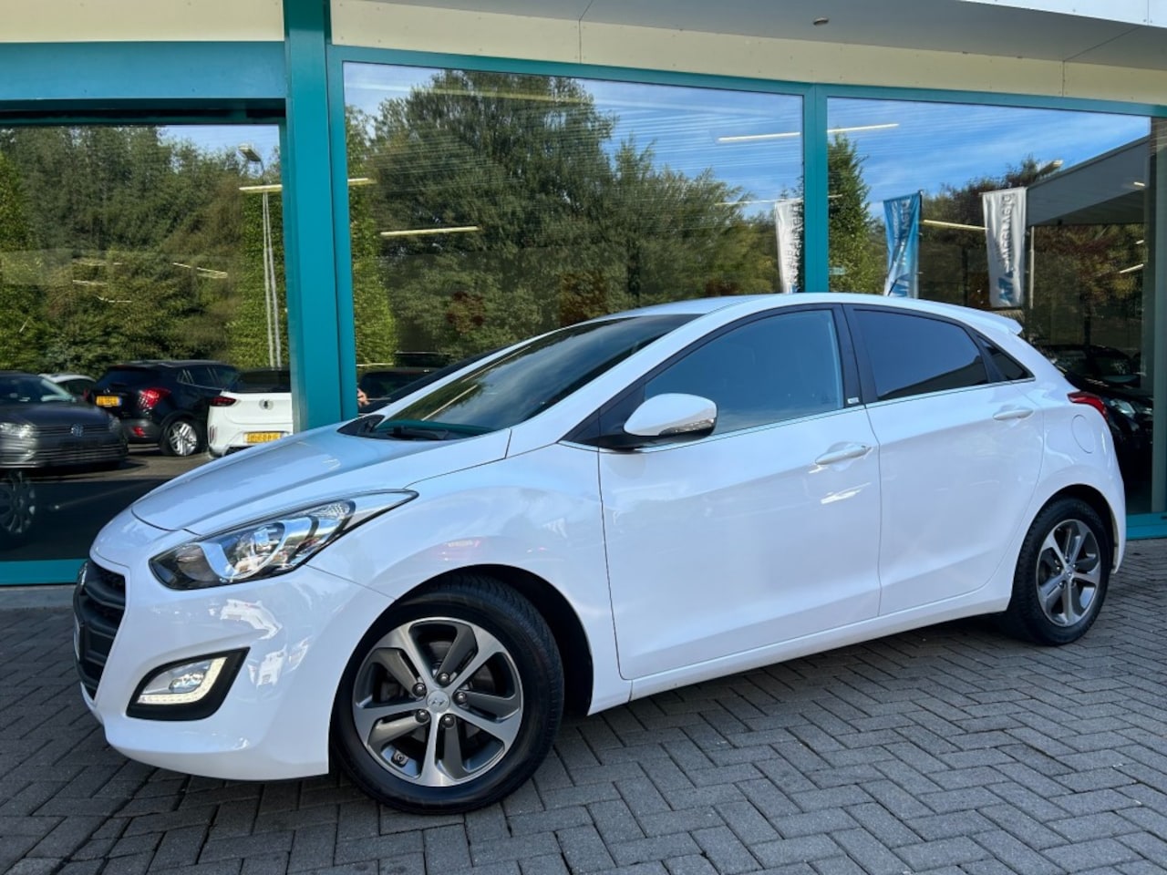 Hyundai i30 - 1.4i BLUE PASSION LED, Cruise, PDC, 16Inch - AutoWereld.nl