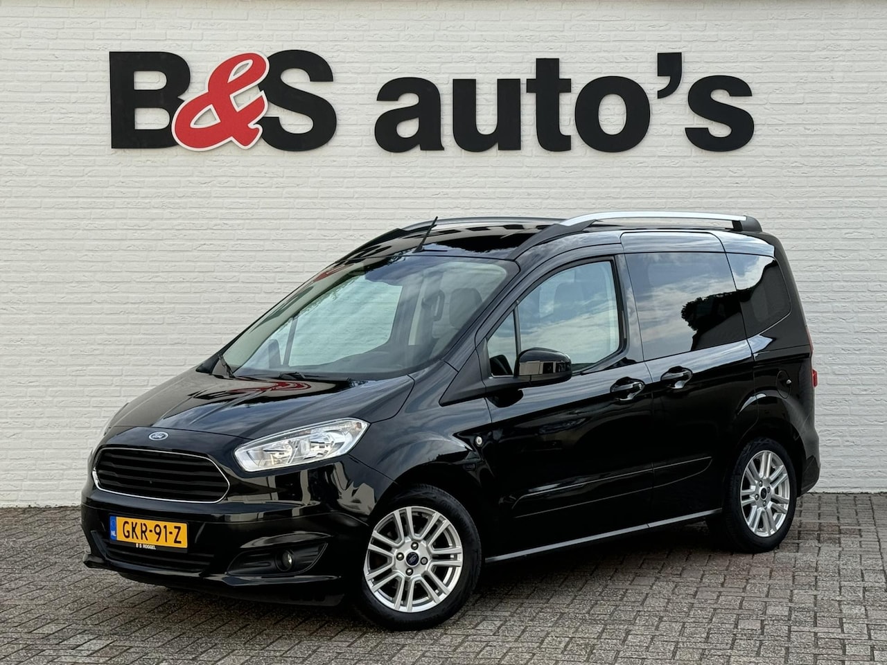 Ford Tourneo Courier - 1.0 Titanium Cruise Clima Stoelverwarming Automatische verlichting Trekhaak Pdc - AutoWereld.nl