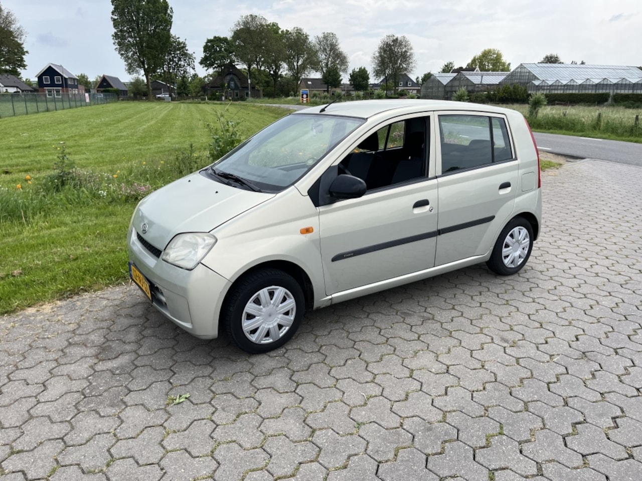 Daihatsu Cuore - 1.0-12V Nagano 5 deurs nw apk - AutoWereld.nl