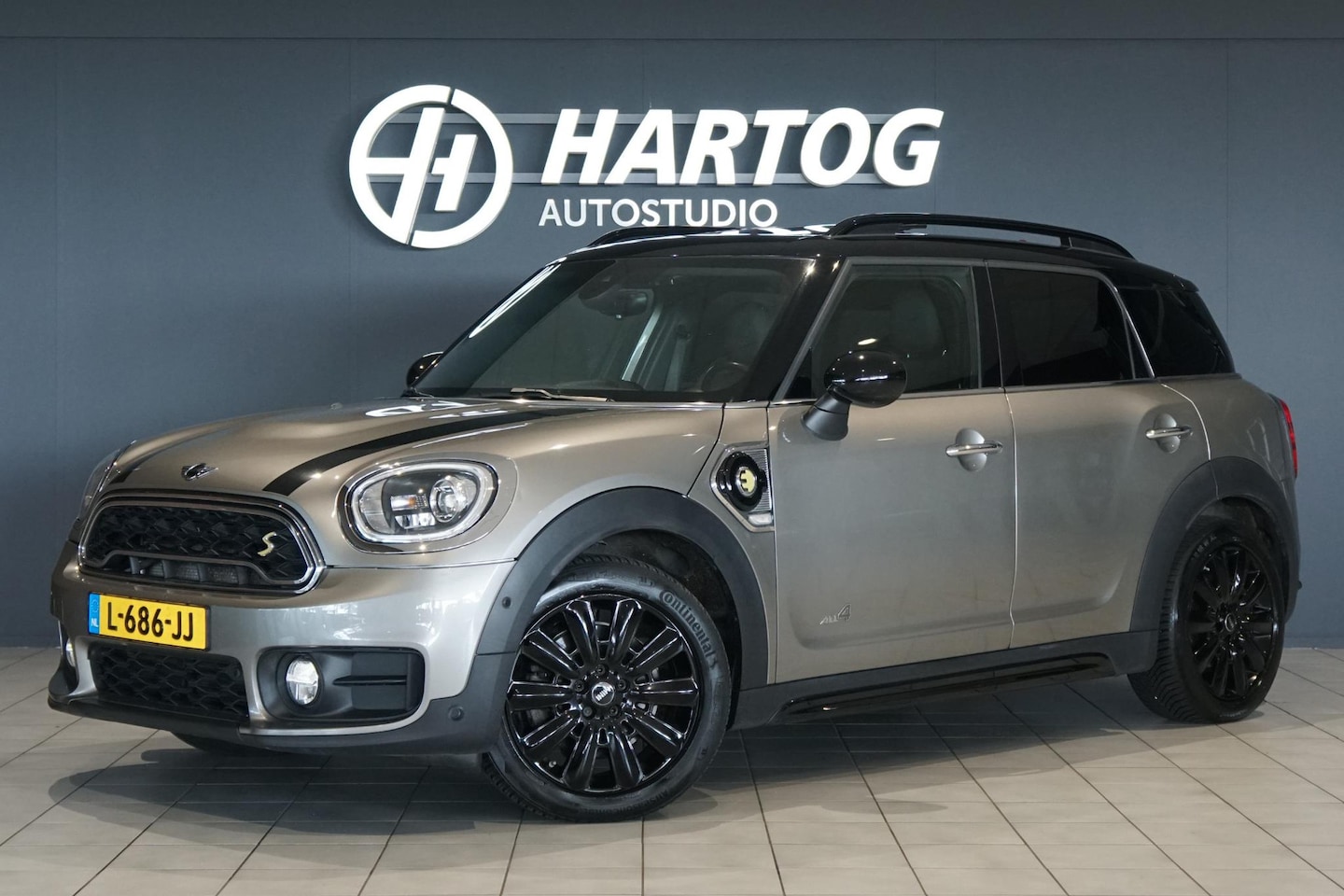 MINI Countryman - Mini 2.0 Cooper S E ALL4 Chili 224PK + PANORAMA / CAMERA / TREKHAAK / LEDER - AutoWereld.nl