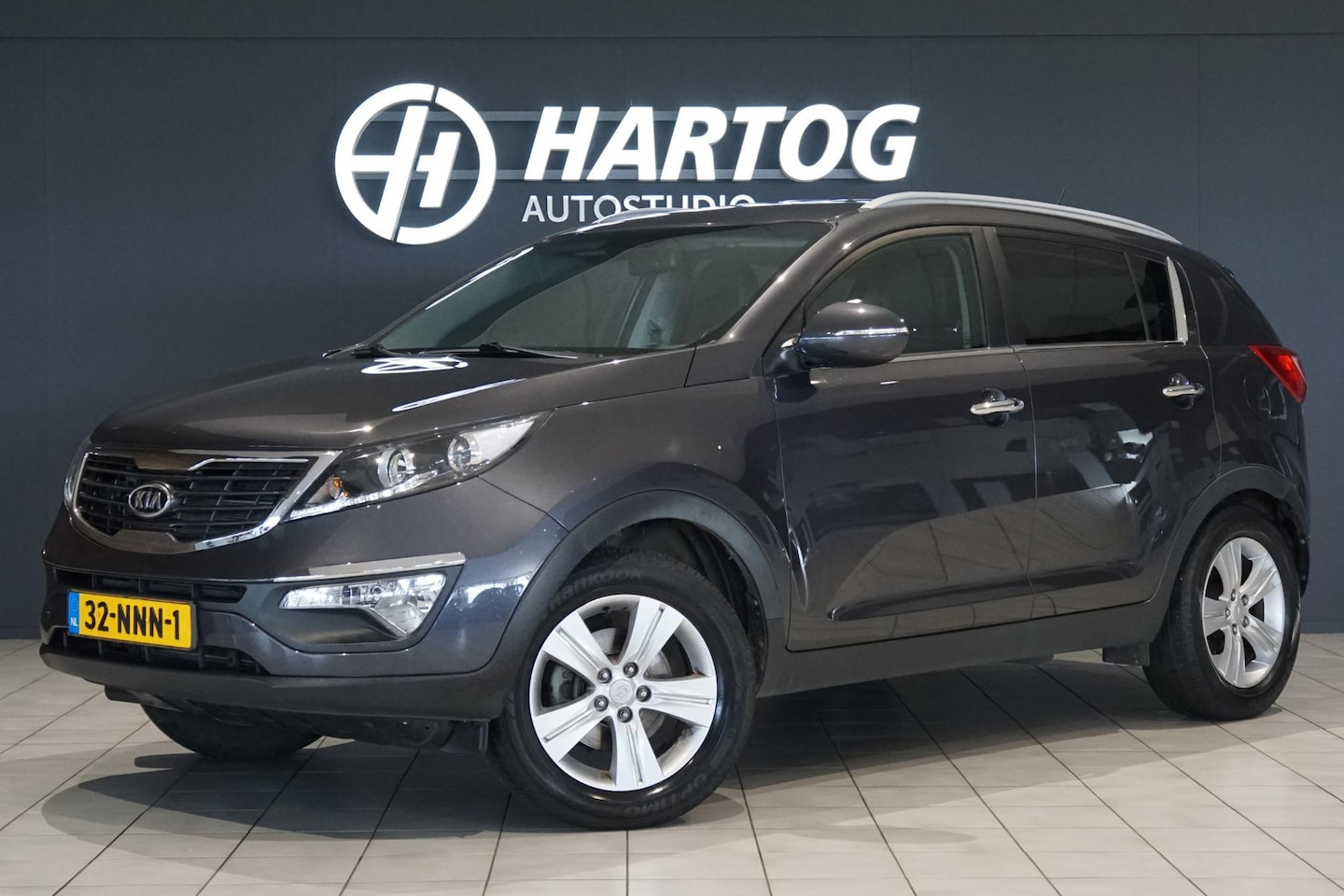 Kia Sportage - 2.0 X-ecutive Plus Pack 163PK + TREKHAAK 1900KG / NAVIGATIE - AutoWereld.nl