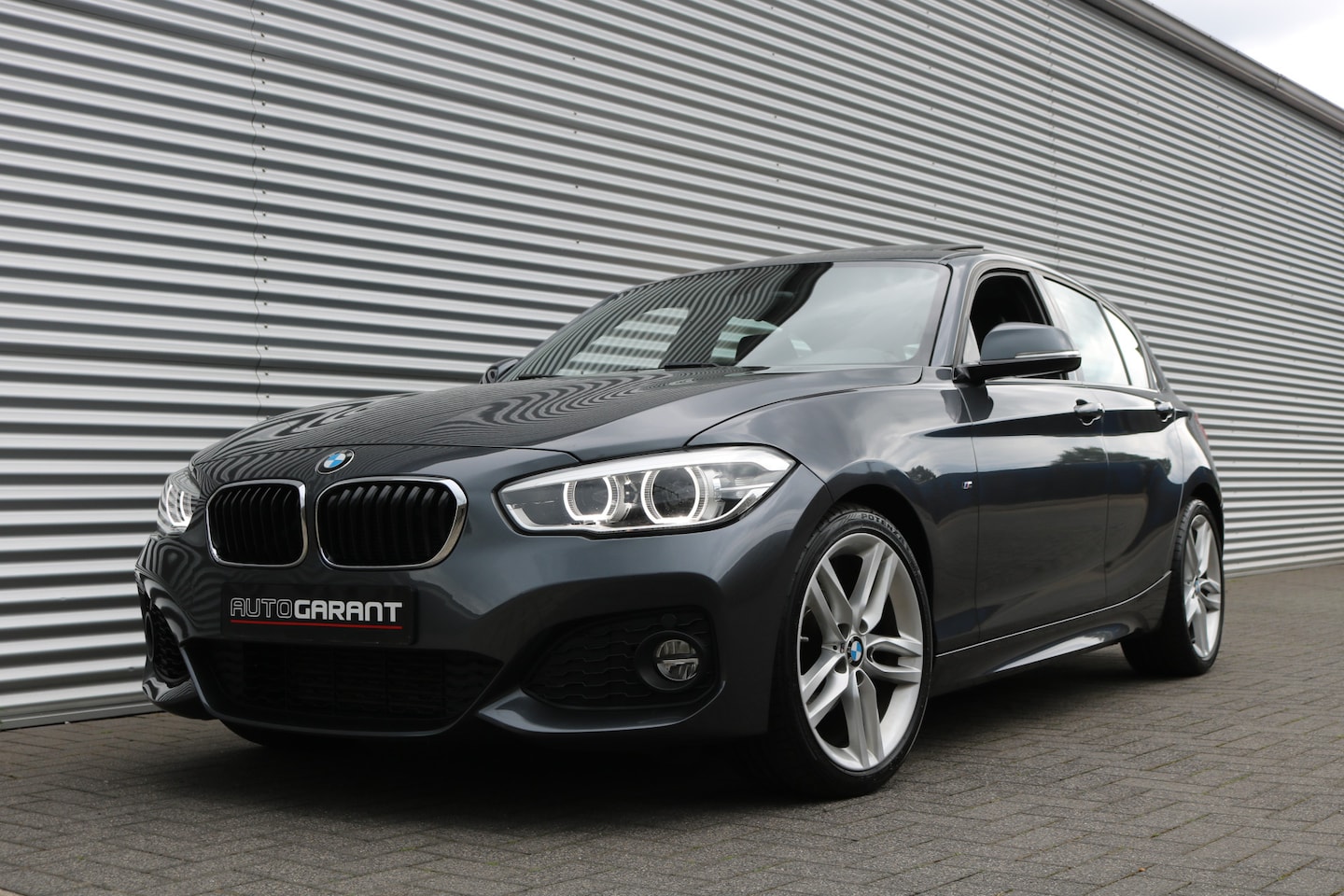 BMW 1-serie - 118i M-Sportpakket Aut (94.384Km Orig NL Auto! NAP! Schuif/Kanteldak Sportleder Navi/Prof - AutoWereld.nl