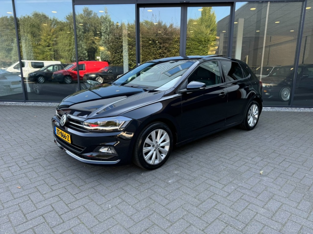 Volkswagen Polo - 1.0 TSI Highline 1.0 TSI Highline,Schuifdak,LED,Half leer,Clima,Adapt Cruise,LMV - AutoWereld.nl