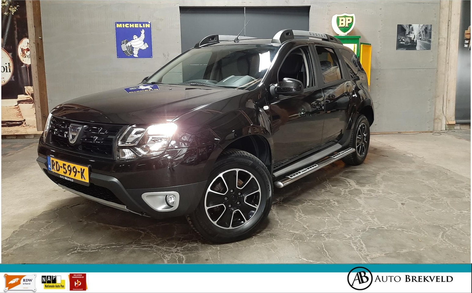 Dacia Duster - 1.2 TCe 4x2 Blackshadow 125PK | Leder | Cruise | PDC | Airco | Navi | LMV | NAP - AutoWereld.nl