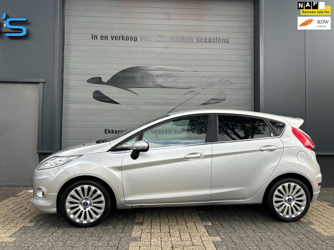 Ford Fiesta - 1.25 ghia 2009 airco clima spoiler nieuwe apk velgen bluetooth xenon stoelverwarming - AutoWereld.nl