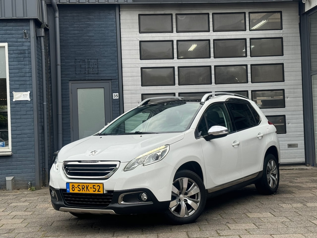 Peugeot 2008 - 1.2 VTi Allure | Clima | Navi | Cruise | Pano | PDC | N.A.P - AutoWereld.nl