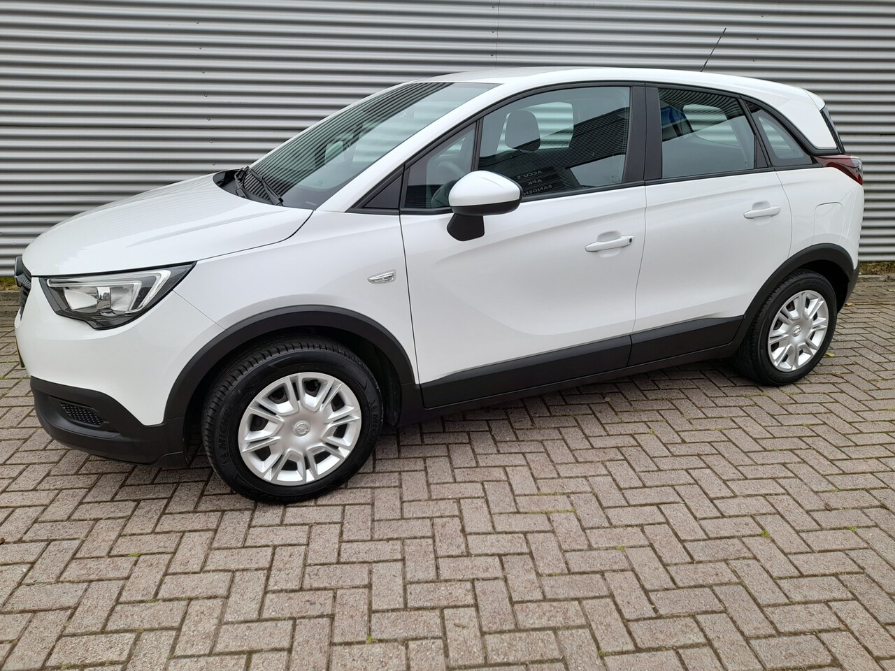 Opel Crossland X - 1.2 Edition | Airco | Hoge zit | Zeer lage km stand! | Ndl auto | Cruise control | RIJKLAA - AutoWereld.nl