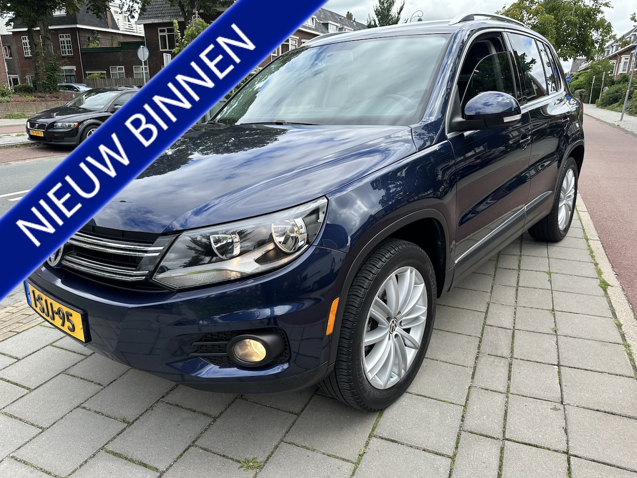 Volkswagen Tiguan - 2.0 TSI Sport&Style 4Motion airco/ecc leer navi apk - AutoWereld.nl