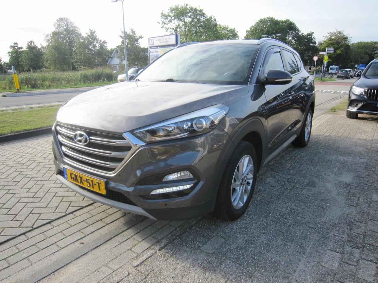 Hyundai Tucson - 1.6 GDi Premium leer navi camera - AutoWereld.nl