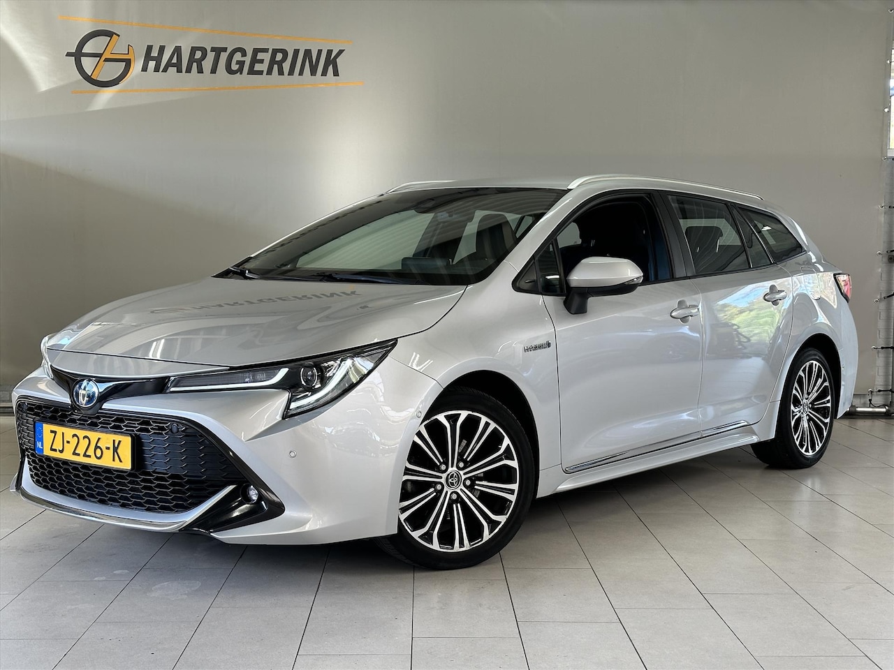 Toyota Corolla Touring Sports - 2.0 Hybrid Style180pk* Navi / PDC / Cruise / LMV / Camera etc.etc. - AutoWereld.nl