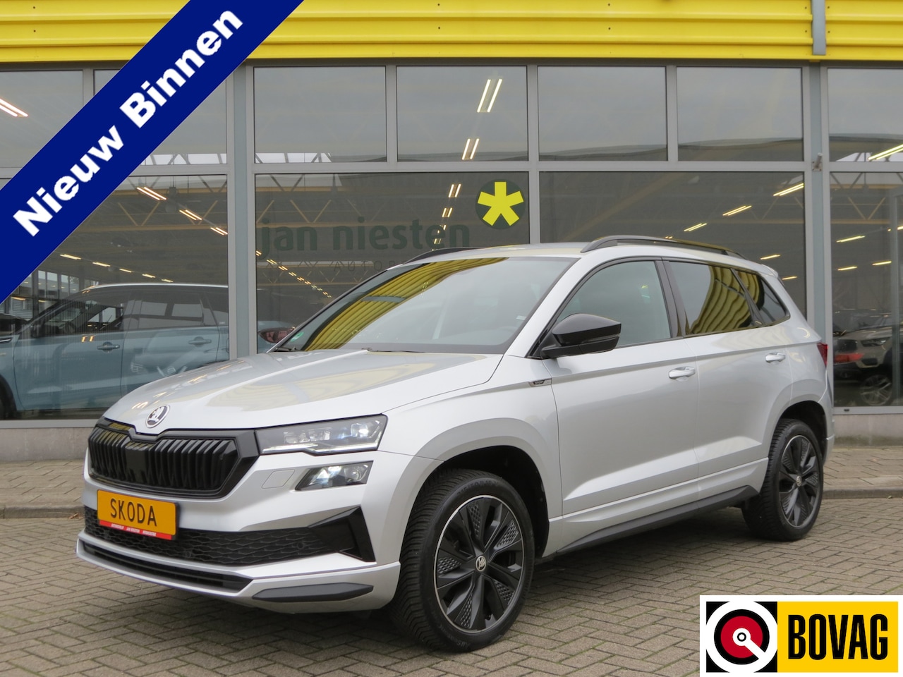 Skoda Karoq - 1.5 TSI AUTOMAAT / SPORTLINE / NAVI / ADAPTIVE CRUISE - AutoWereld.nl