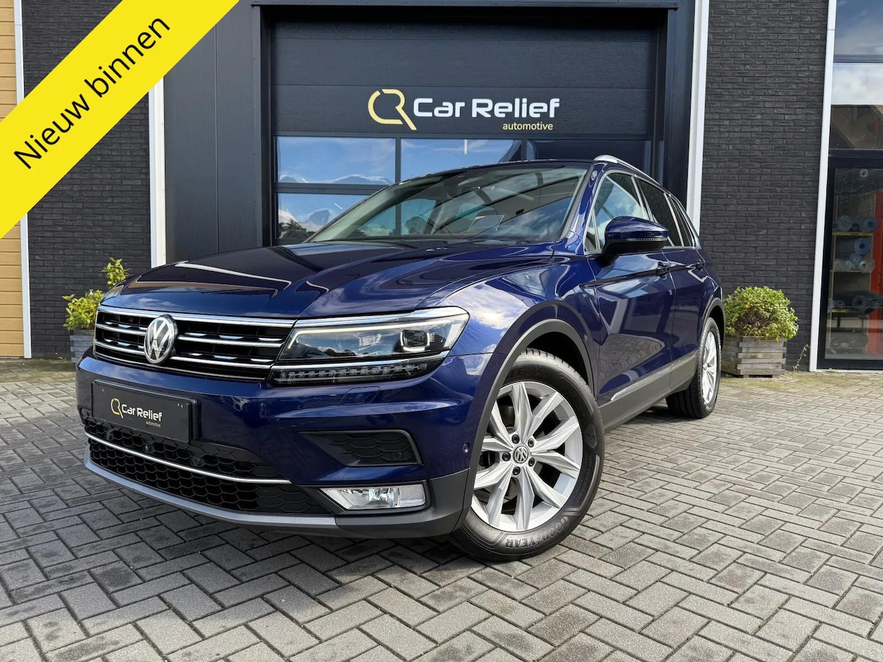 Volkswagen Tiguan - 1.4 TSI ACT Highline 1.4 TSI ACT Highline, Panoramdak, HuD, Apple Carplay, Elektrisch verstelbare zetels - AutoWereld.nl