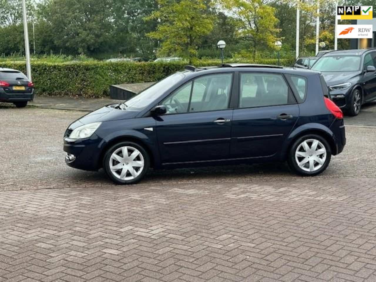 Renault Scénic - 2.0-16V Tech Line Automaat.bj.2007,kleur:blauw,panoramadak,climate,trekhaak,stereo APK 09/ - AutoWereld.nl