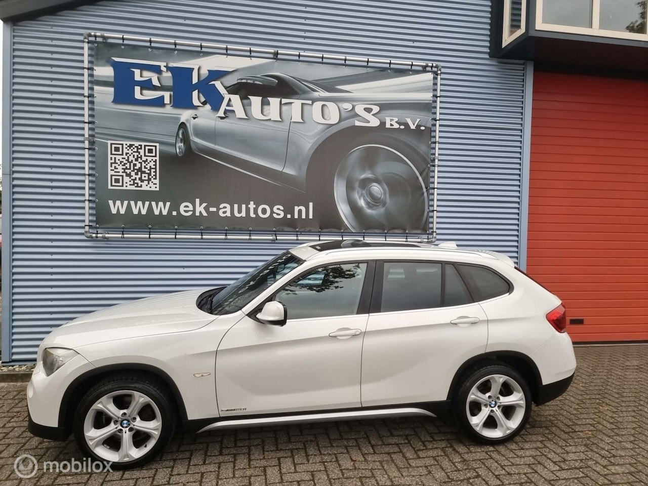 BMW X1 - sDrive20i 184pk Aut-8. Parelmoer wit, 1e eigenaar.. - AutoWereld.nl