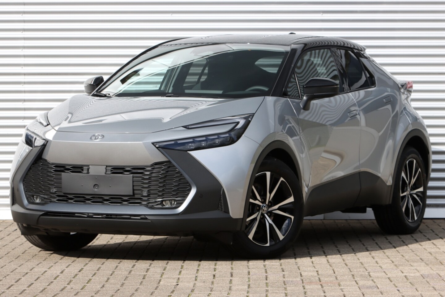 Toyota C-HR - 1.8 Hybrid 140 First Ed. Bi-Tone NIEUW - AutoWereld.nl