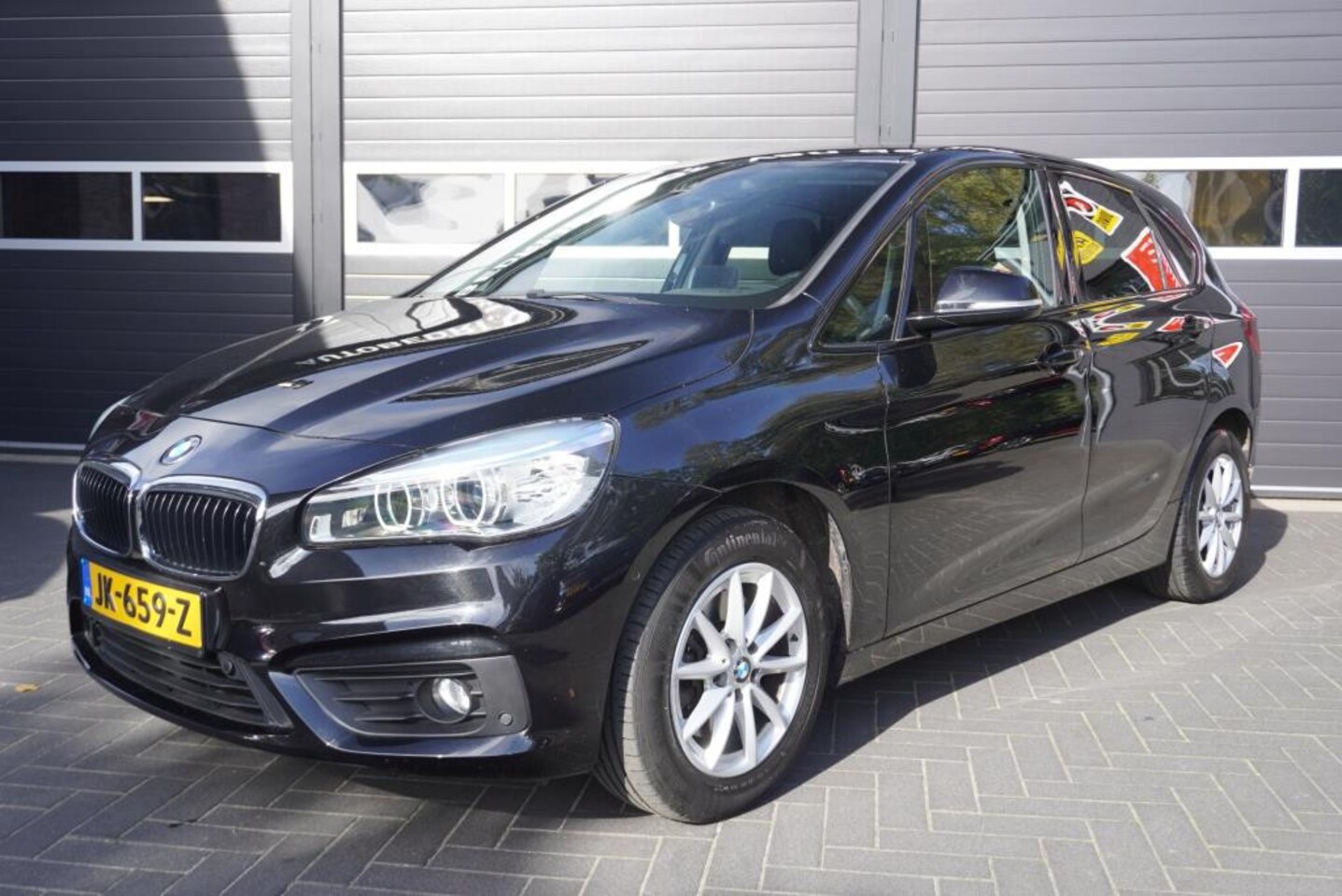 BMW 2-serie Active Tourer - 218i Centennial High Executive Aut/Airco/Navi/CC/Park.sensoren - AutoWereld.nl