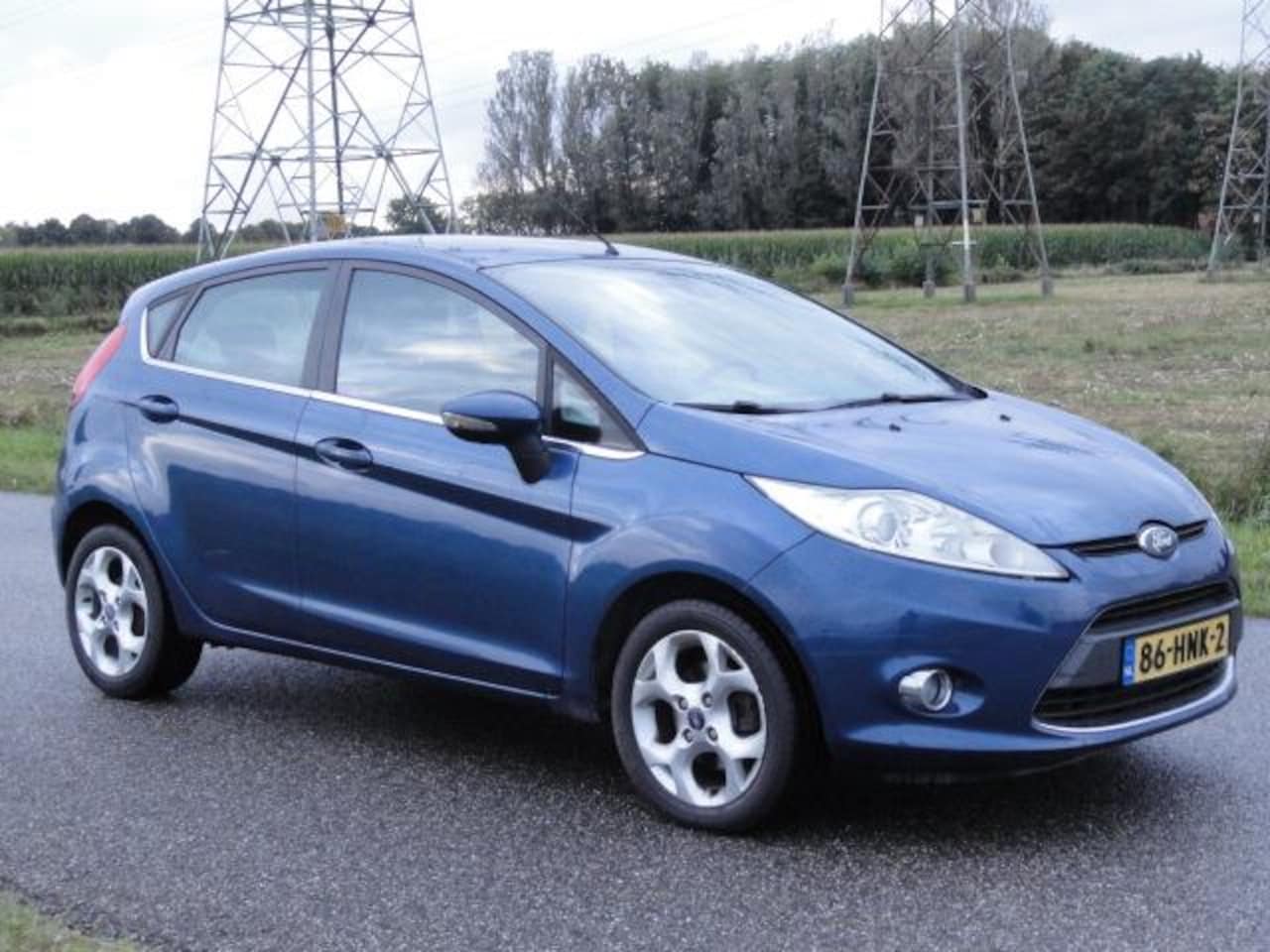 Ford Fiesta - 1.4 Titanium Met ECC + KEYLESS + PDC+ NAVIG - AutoWereld.nl