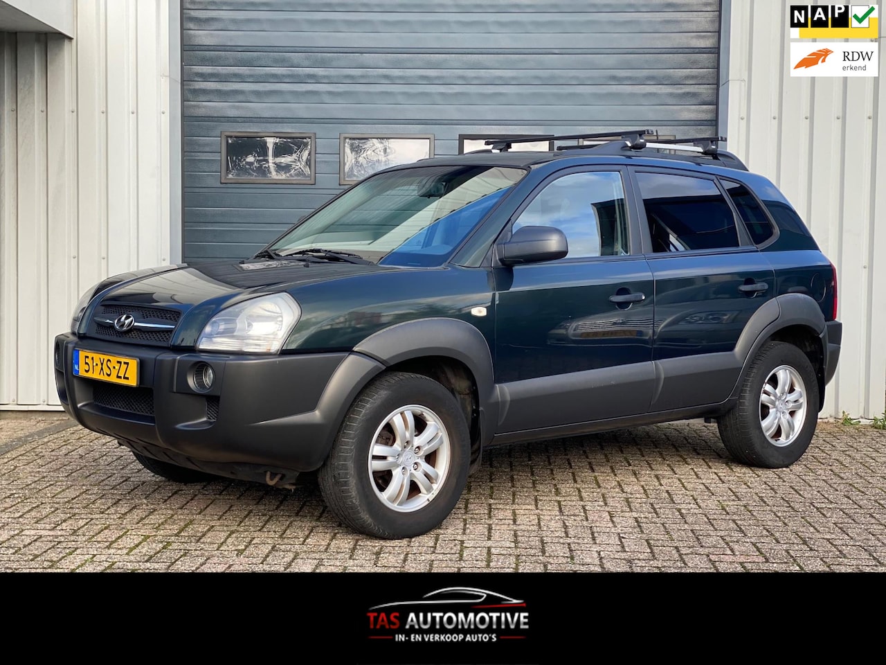 Hyundai Tucson - 2.0i Dynamic Cross 2e EIG / AIRCO / CRUISE! - AutoWereld.nl