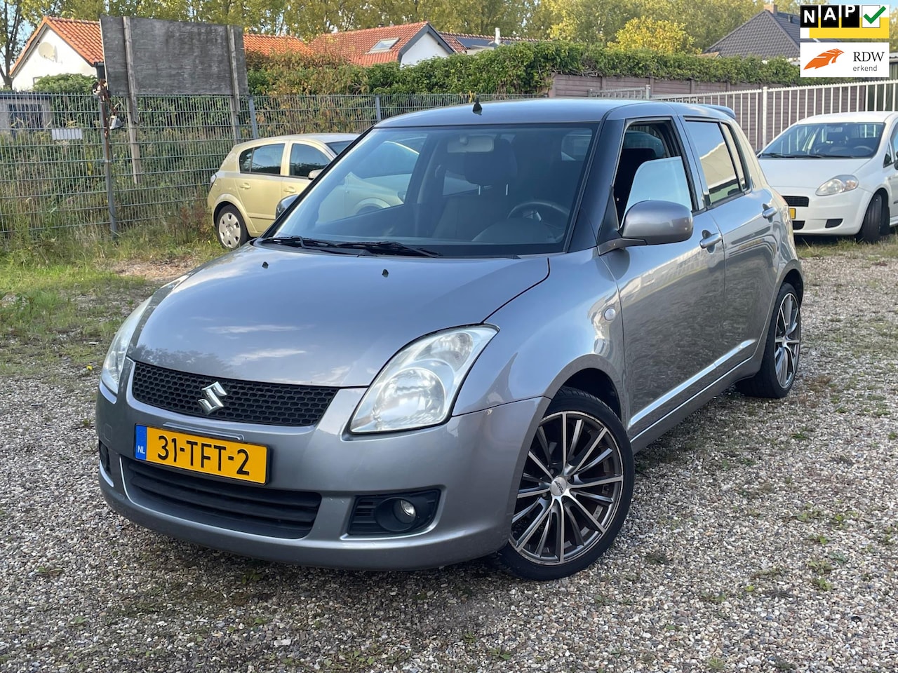 Suzuki Swift - Lees tekst !!!!!! 1.3 Base airco leder - AutoWereld.nl