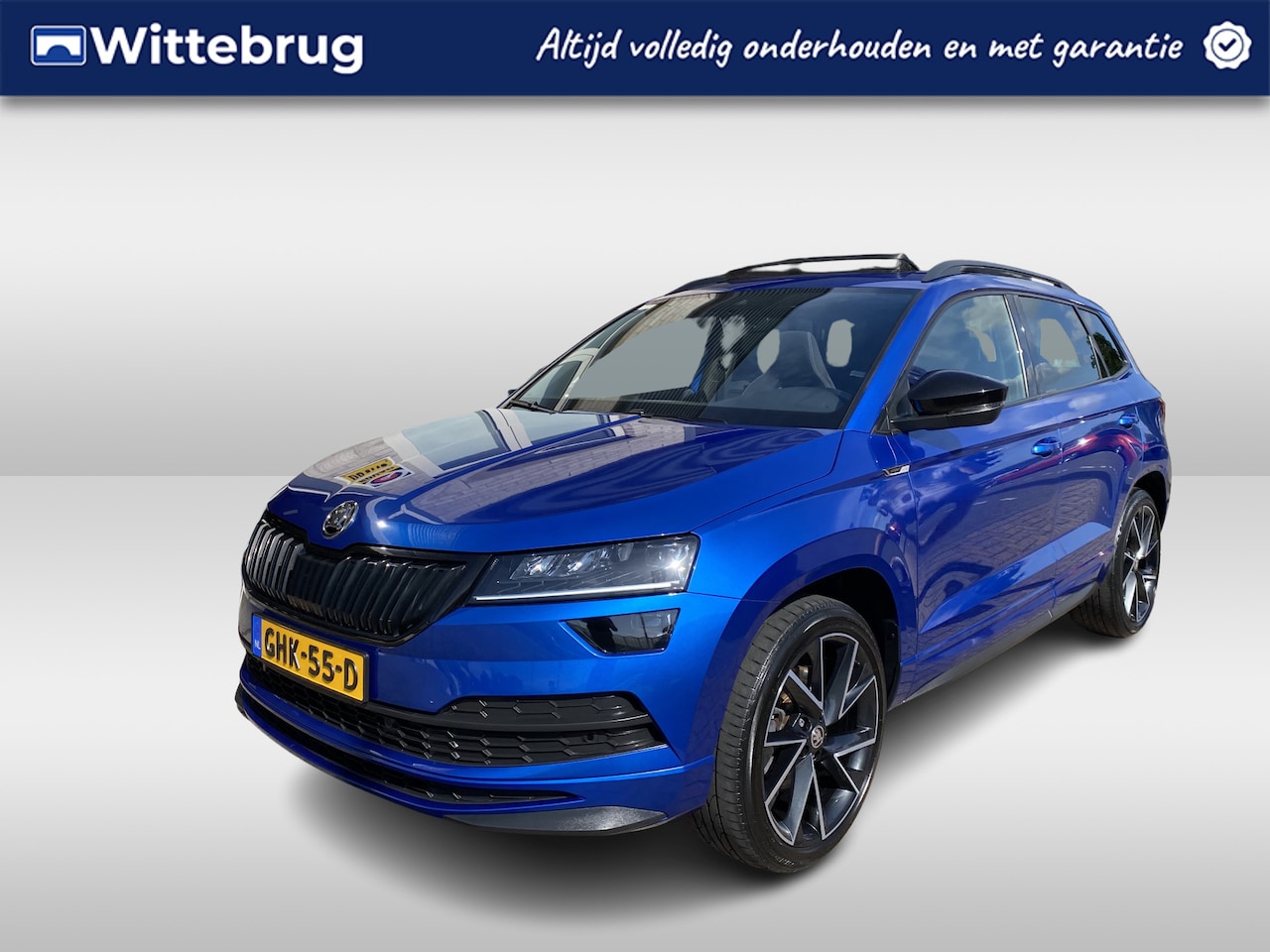 Skoda Karoq - 2.0 TSI 4x4 Sportline Business / AUTOMAAT / PANORAMADAK / TREKHAAK / NAVIGATIE / APP-CONNE - AutoWereld.nl