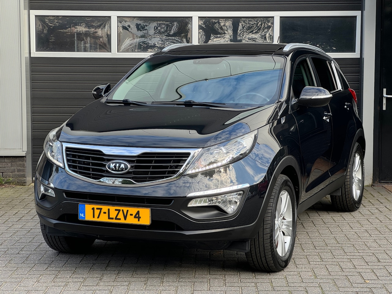 Kia Sportage - 2.0 X-ecutive Plus Pack First Edition Pano, Cruise, Climate Control, NAP - AutoWereld.nl