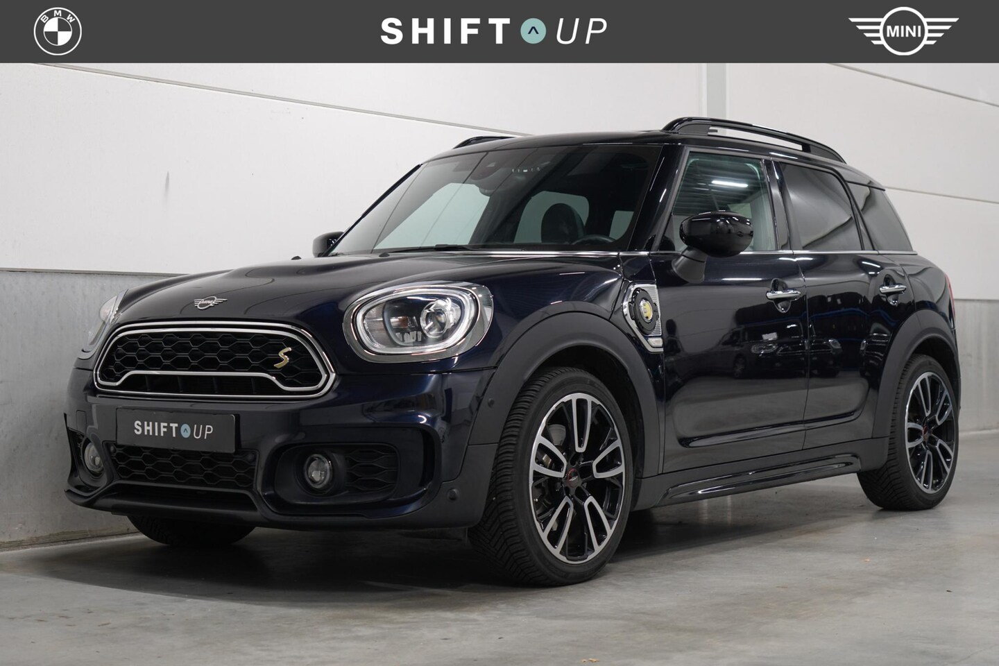 MINI Countryman - Mini 2.0 Cooper S E ALL4 JCW | Panoramadak | Harman Kardon | Adapt. Cruise Control | Head - AutoWereld.nl