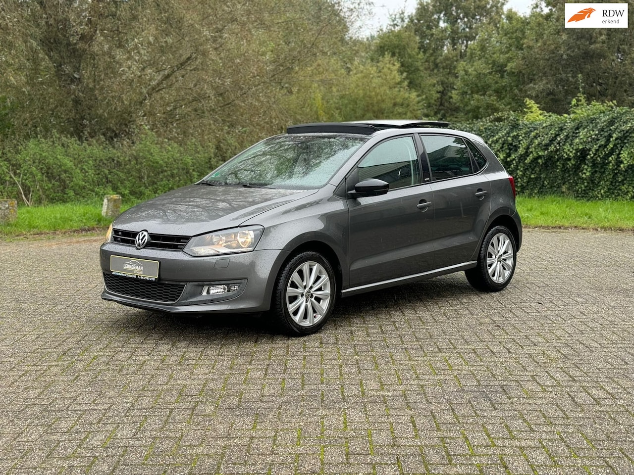 Volkswagen Polo - 1.2 High Line i PANORAMADAK I CRUISE I PDC I VOLL ONDERHOUD - AutoWereld.nl