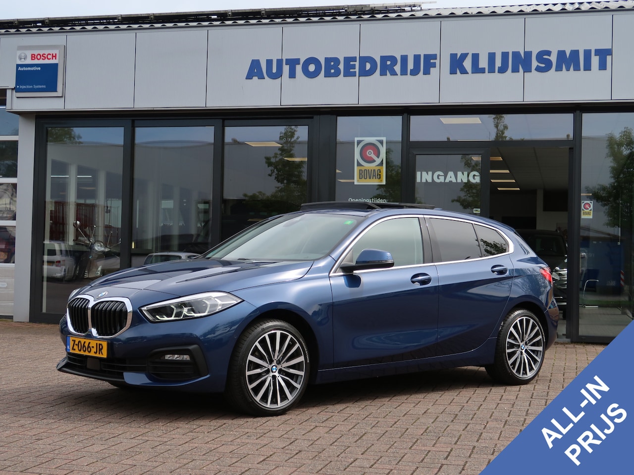 BMW 1-serie - 118i High Executive | Panoramadak | Leder | 18'' | Driving Assist | Led | - AutoWereld.nl