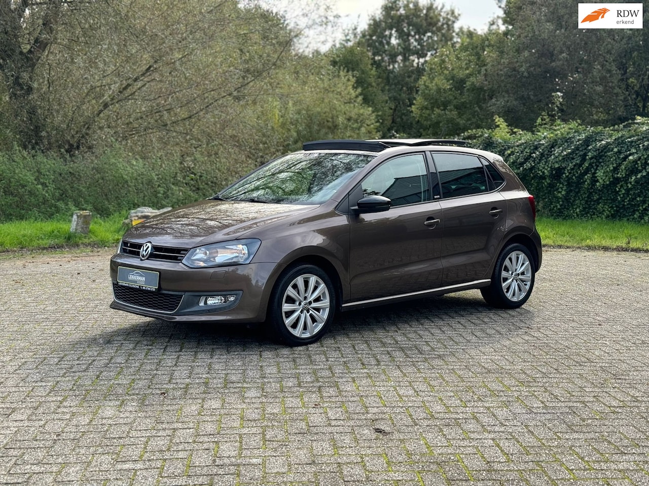 Volkswagen Polo - 1.2 High Line PANO i TREKHAAK I LAGE KM I CRUISE I PDC - AutoWereld.nl